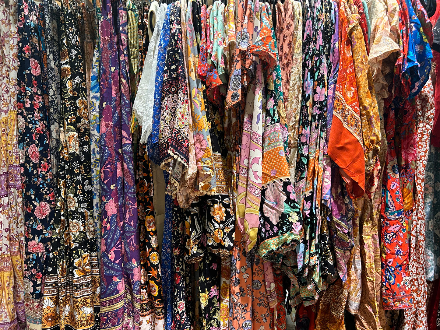 Colorful floral clothing on a rack