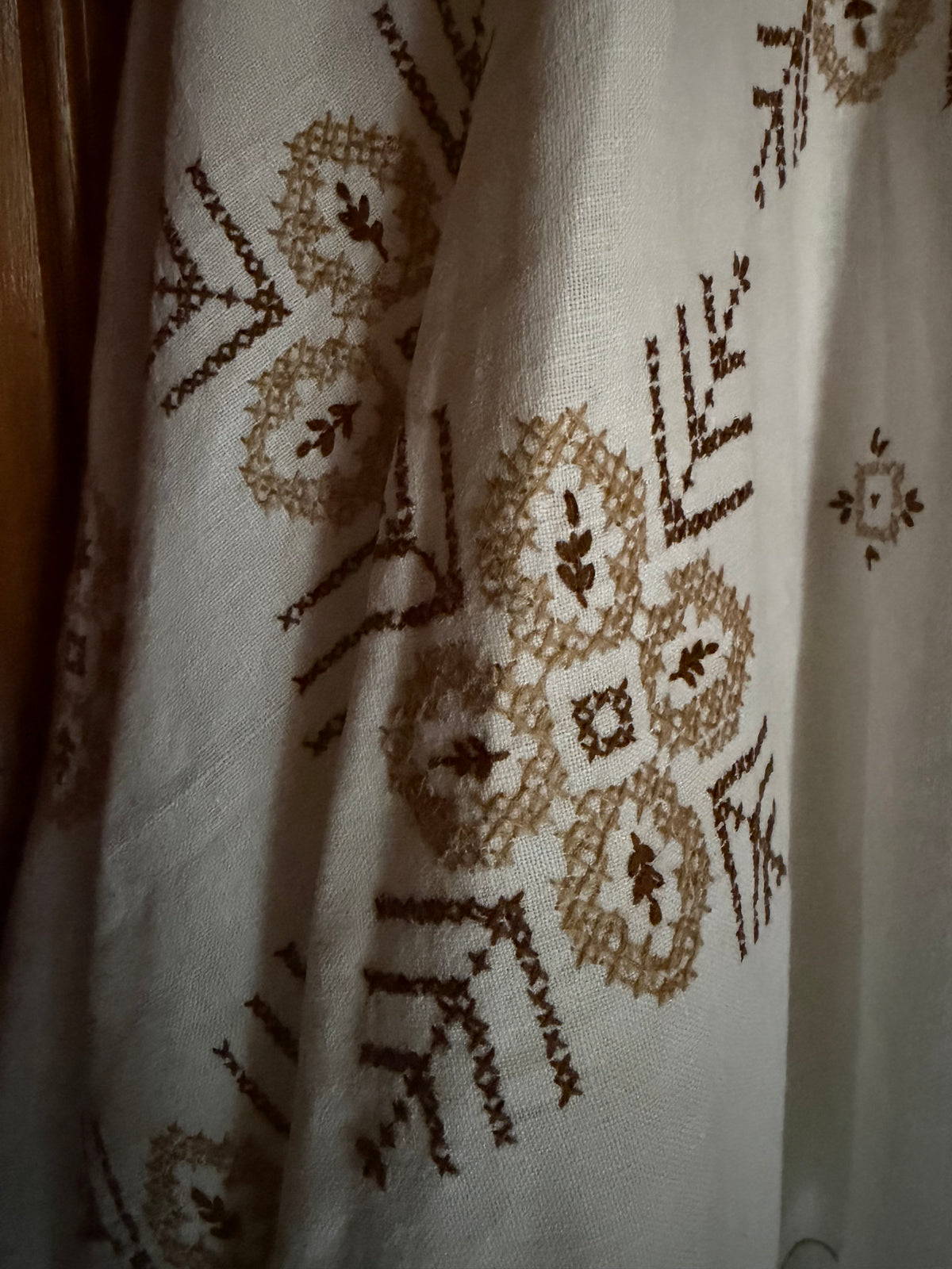 Close up of brown embroidery details. 