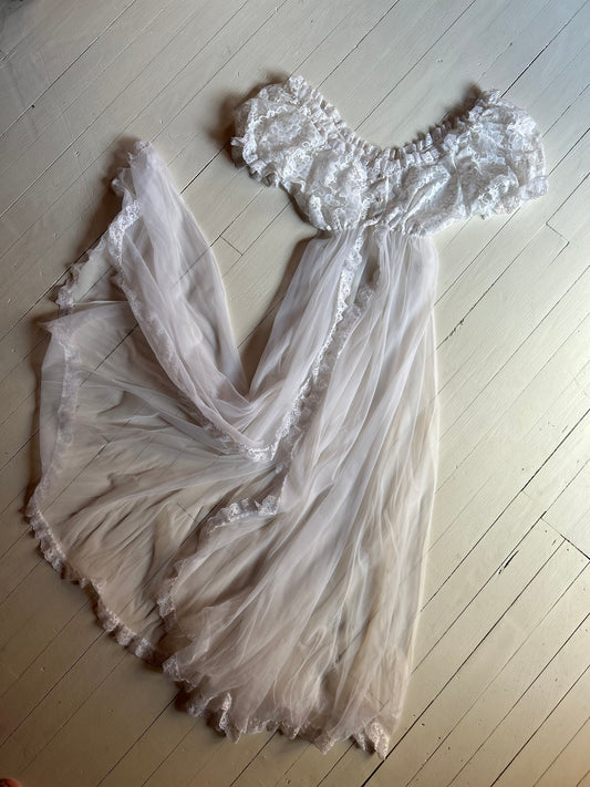 White sheer and lace lingerie on a light wooden floor