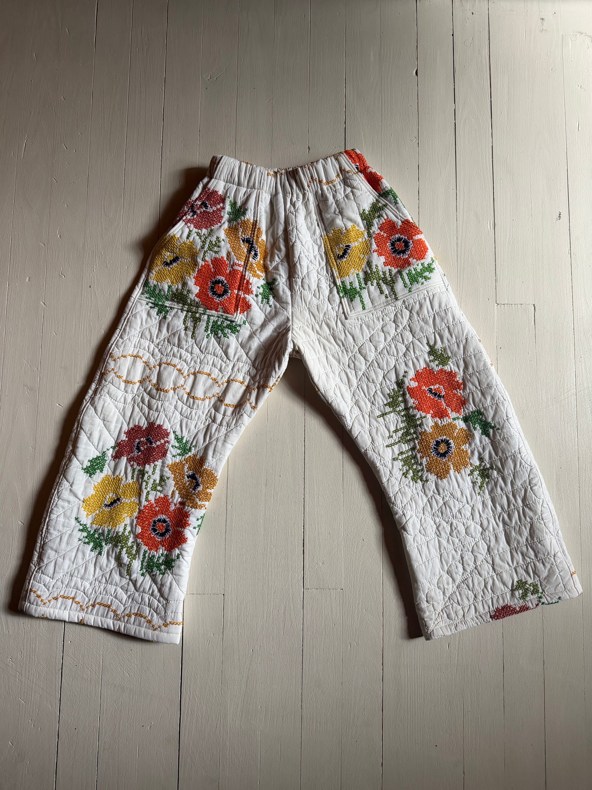 Pants laying on wood floor