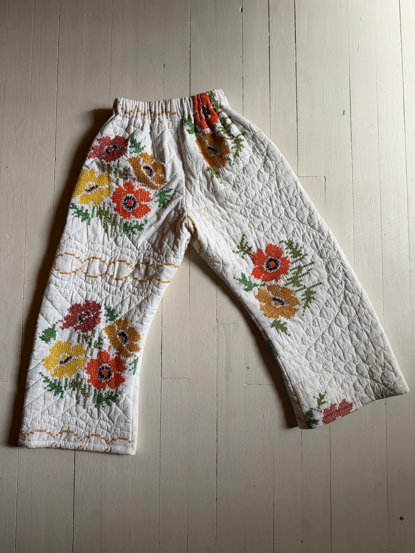 Pants laying on wood floor