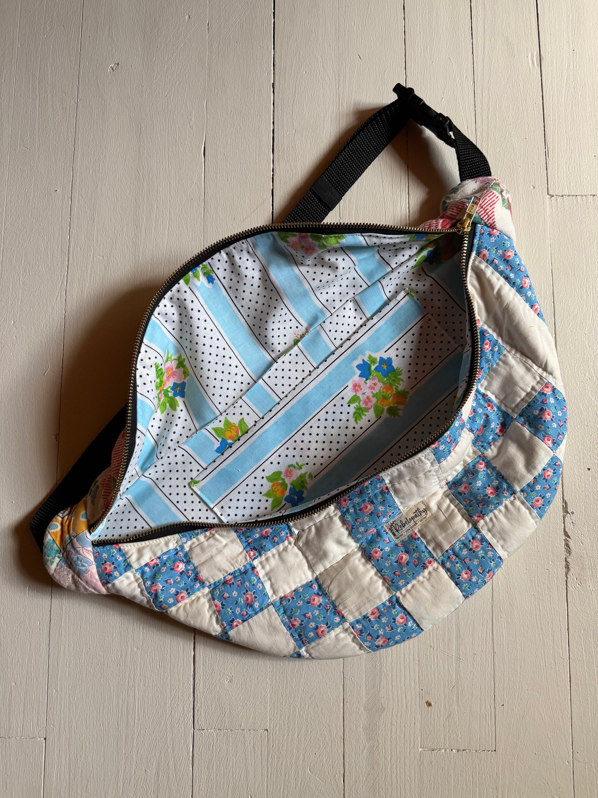 Floral and patchwork patterned bag on a wooden surface